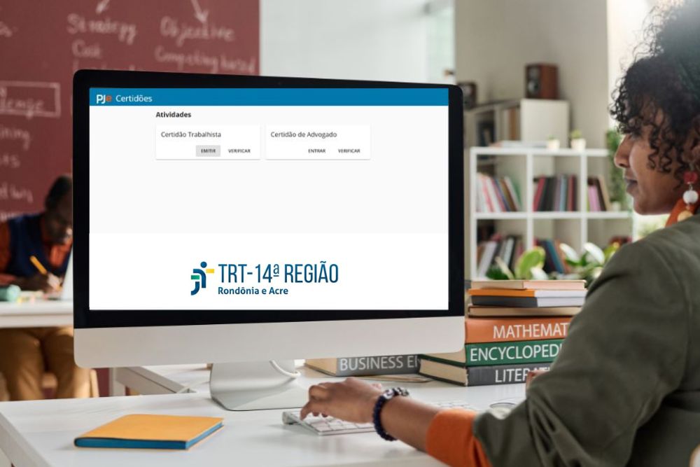 Imagem com a presença de uma mulher digitando em um computador, que está aberto na tela do TRT-14ª REGIÃO Rondônia e Acre.