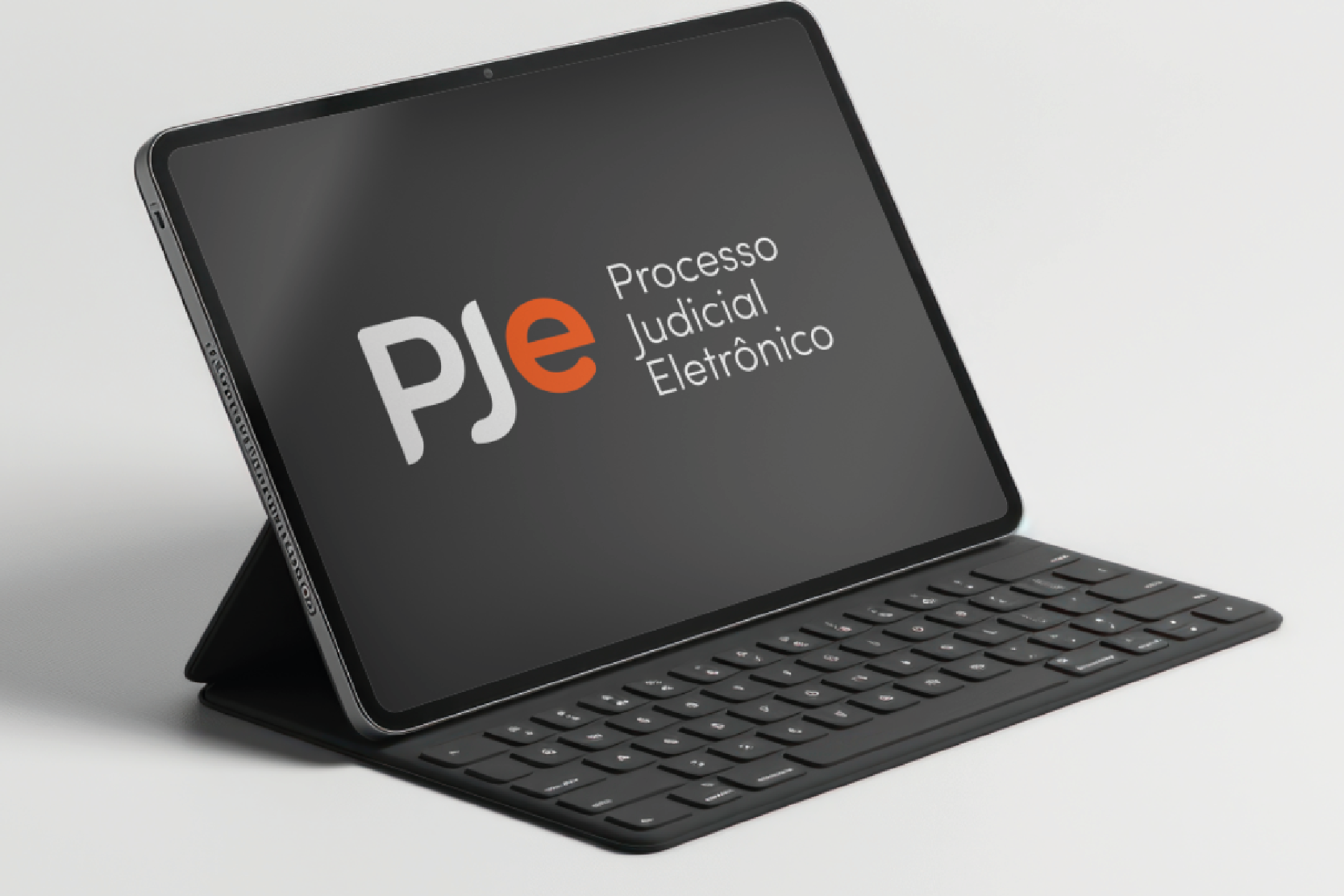 Imagem ilustrativa de tablet com teclado com a logo do PJe na tela.